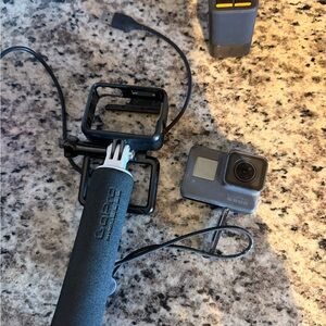 GoPro Action Camera with Black Handle and Mounts